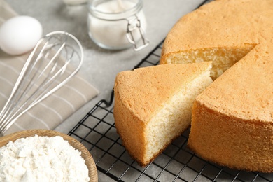 Photo of Delicious fresh homemade cake on grey marble table, closeup