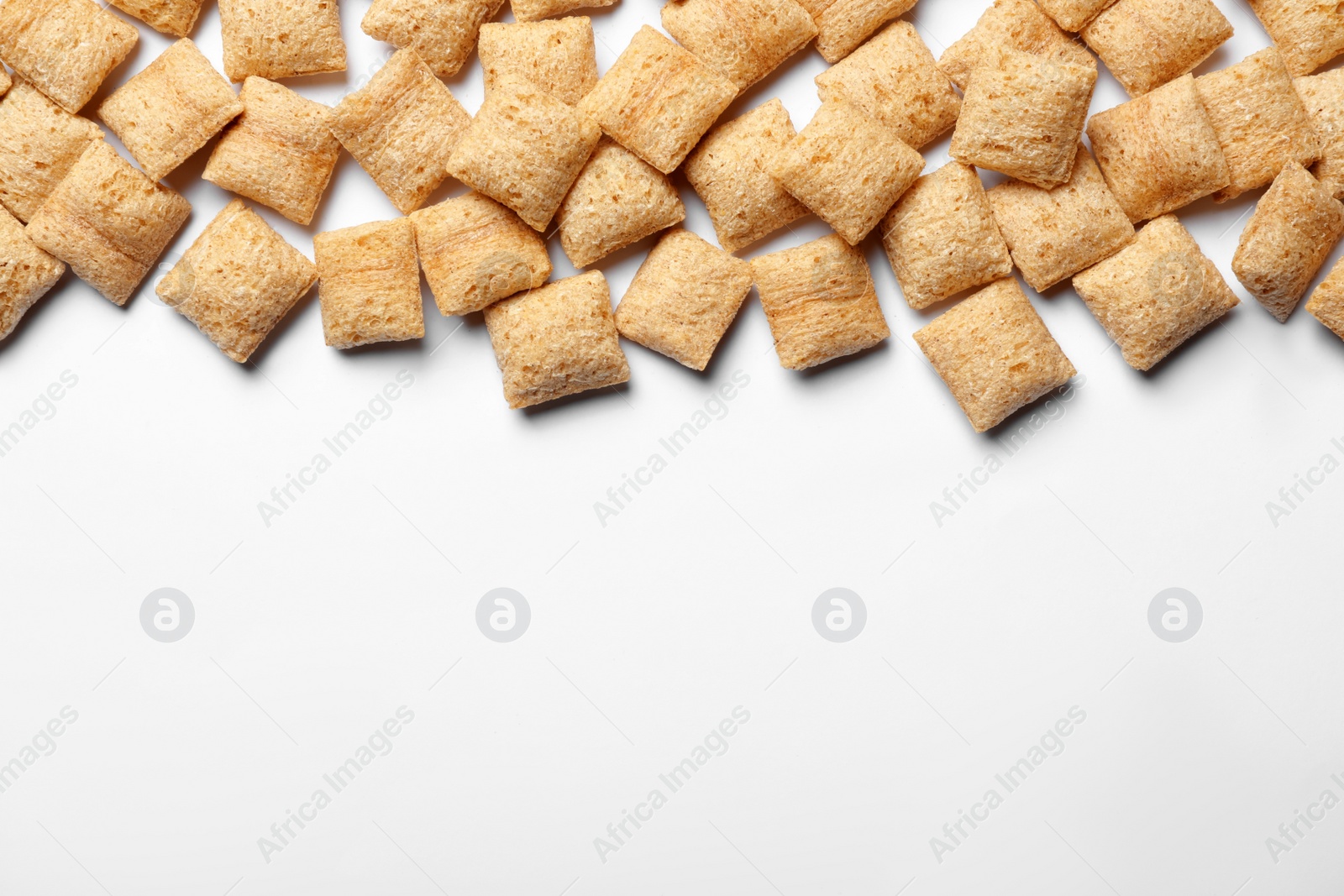 Photo of Delicious corn pads on white background, top view