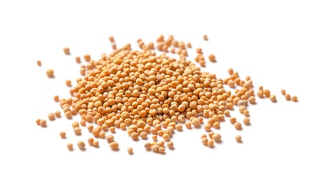 Many whole mustard seeds on white background