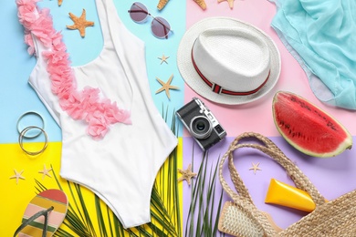 Composition with beach accessories on color background, flat lay