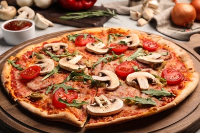 Photo of Hot delicious pizza baked in oven on table