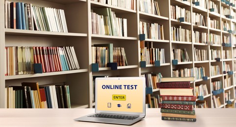 Image of Laptop with online test on screen in library. Banner design