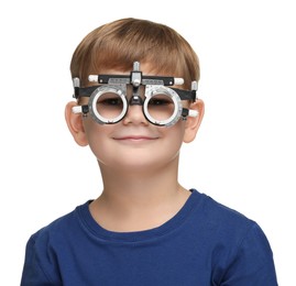 Photo of Vision testing. Little boy with trial frame on white background