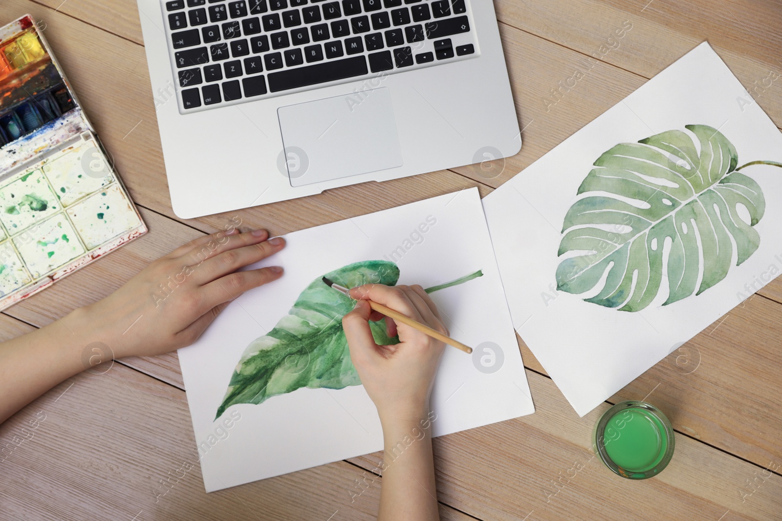 Photo of Woman drawing picture at online art lesson, top view. Distant learning