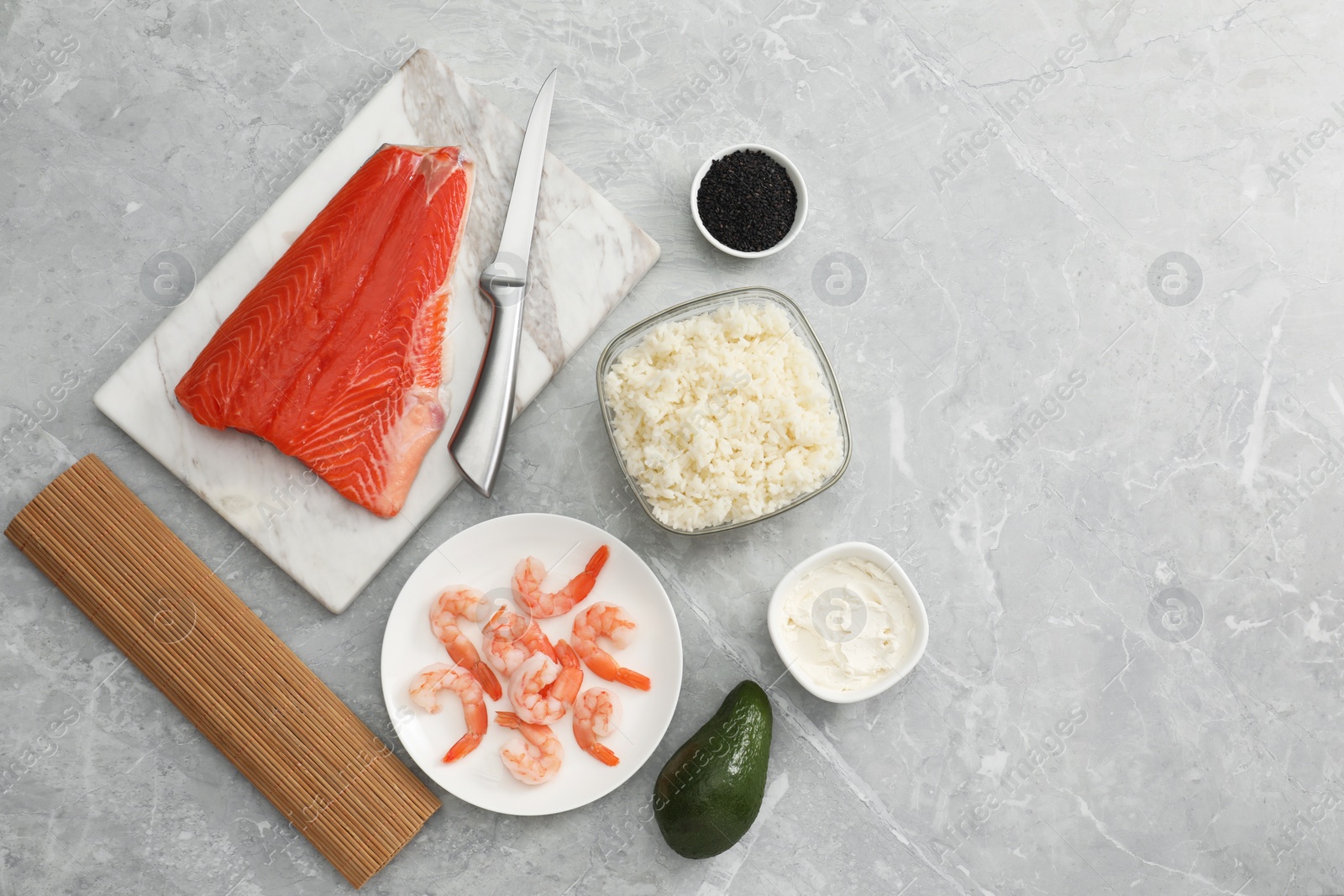 Photo of Flat lay composition with ingredients for sushi on grey marble table. Space for text