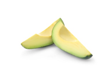 Slices of ripe avocado on white background