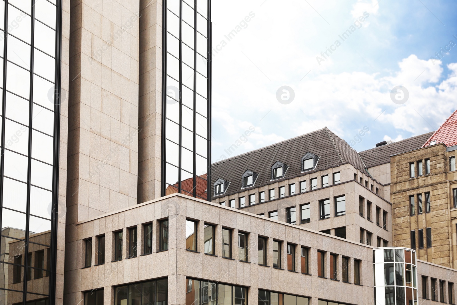 Photo of Beautiful view of modern buildings with big windows in city