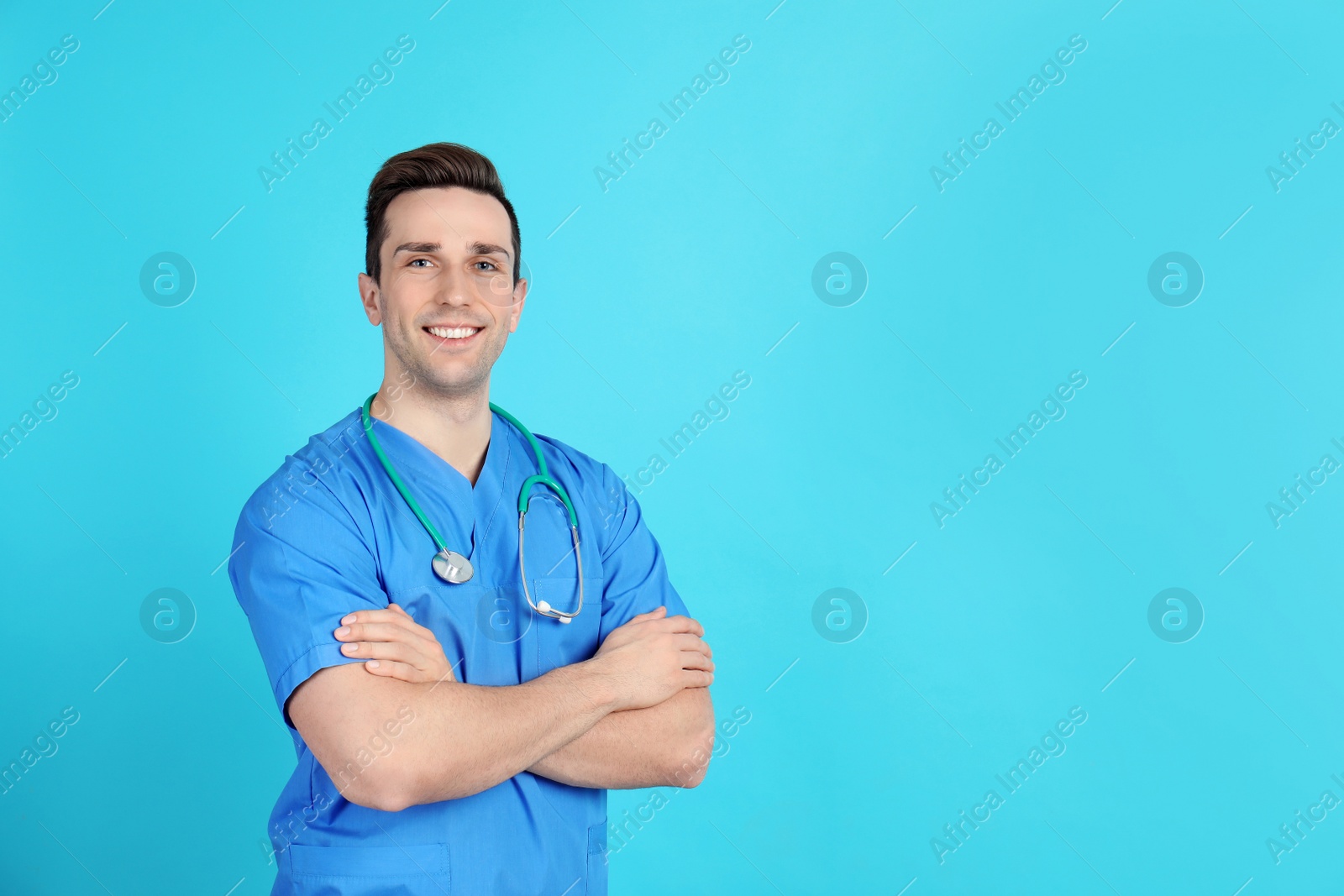 Photo of Portrait of medical assistant with stethoscope on color background. Space for text