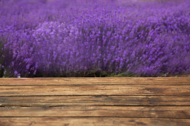 Empty wooden table in fresh lavender field