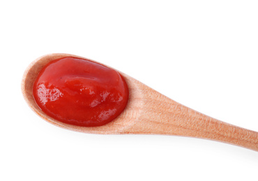 Photo of Tasty tomato sauce in wooden spoon isolated on white, top view