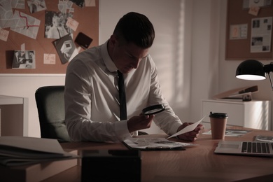 Photo of Detective working at desk in his office