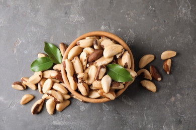 Photo of Flat lay composition with Brazil nuts on grey background