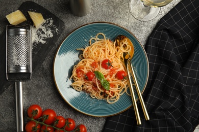 Flat lay composition with tasty pasta on grey table