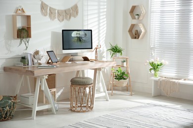 Photo of Stylish home office interior with comfortable workplace