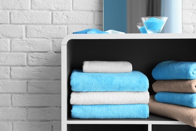 Photo of Many clean towels in bathroom