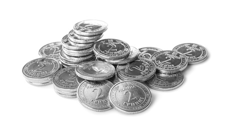 Photo of Many Ukrainian coins on white background. National currency