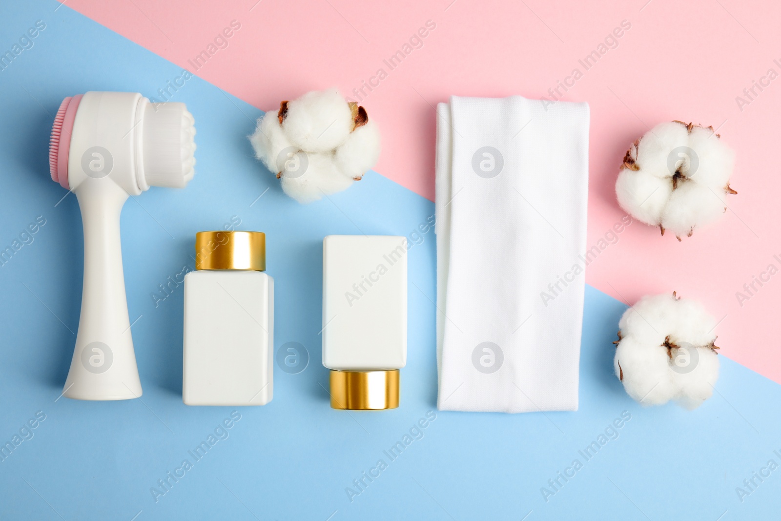 Photo of Flat lay composition with face cleansing brush on color background. Cosmetics tool