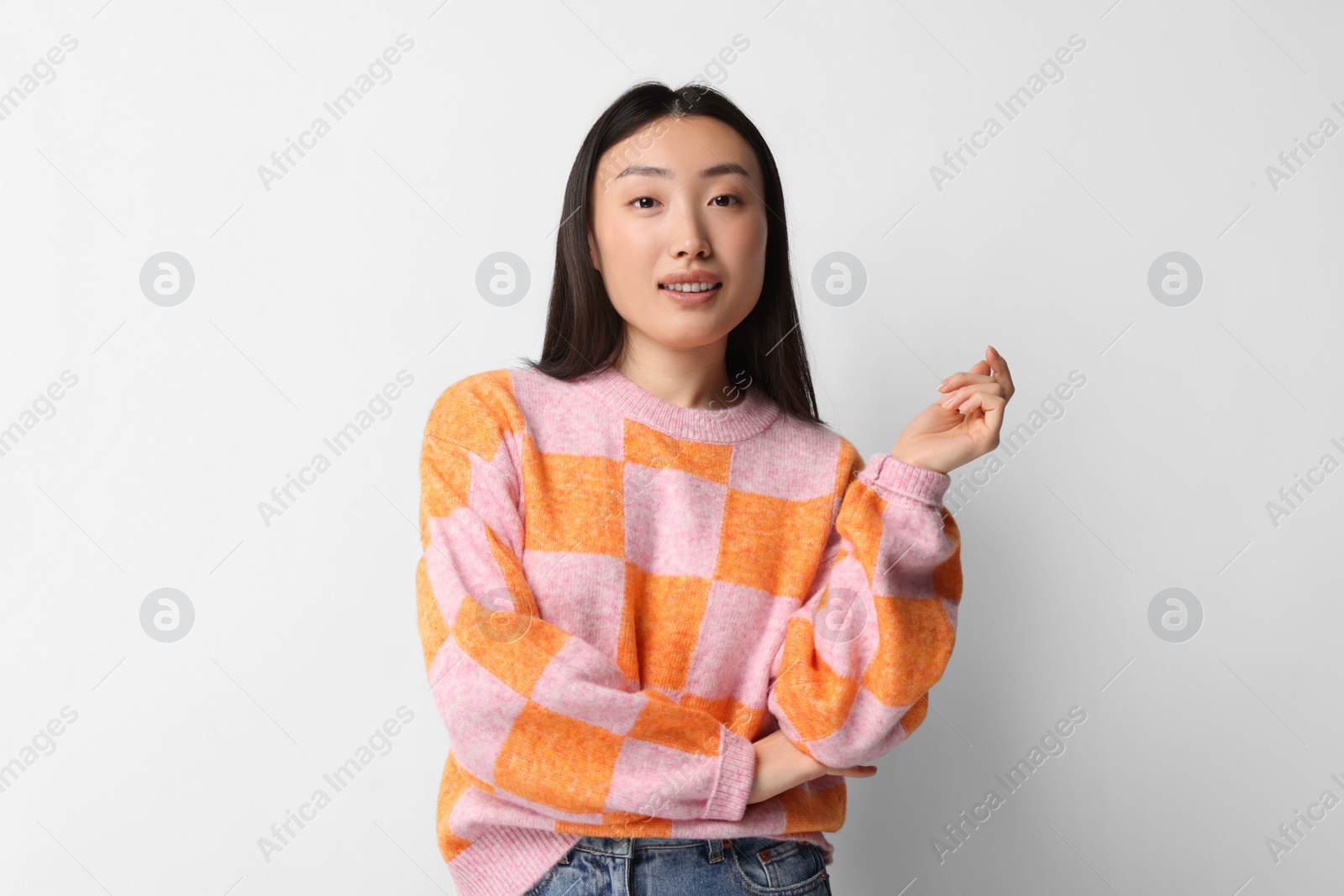 Photo of Portrait of smiling woman on light background