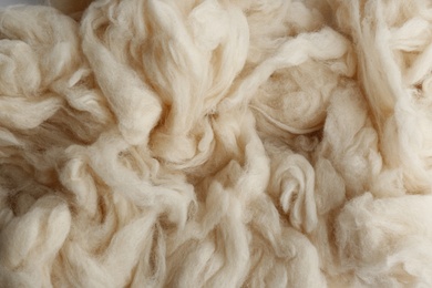 Photo of Soft white wool texture as background, closeup