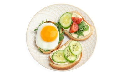 Photo of Slices of bread with different toppings on white background, top view