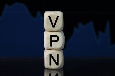 Photo of Acronym VPN (Virtual Private Network) made of wooden beads on dark background