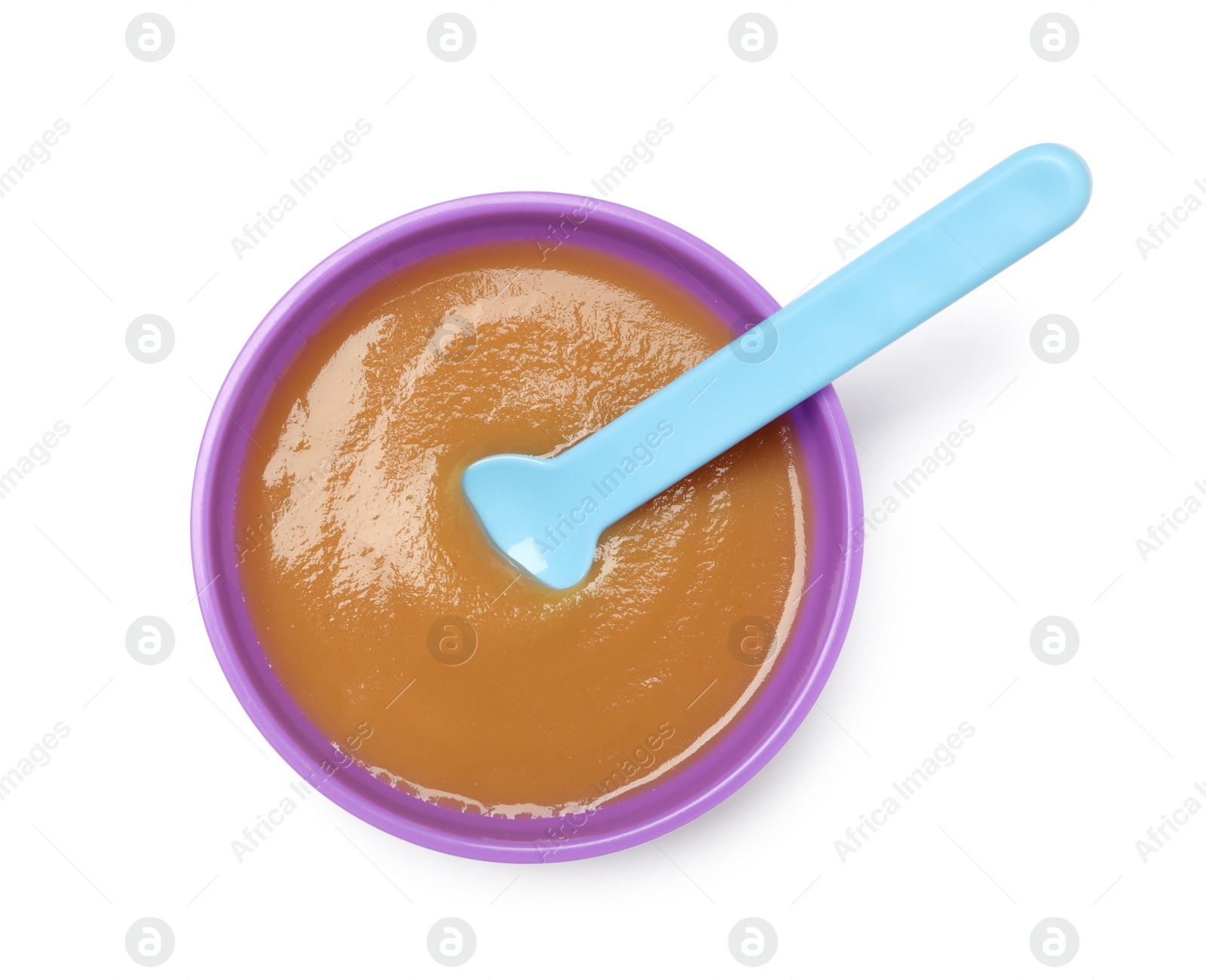 Photo of Delicious baby food and spoon in bowl isolated on white, top view