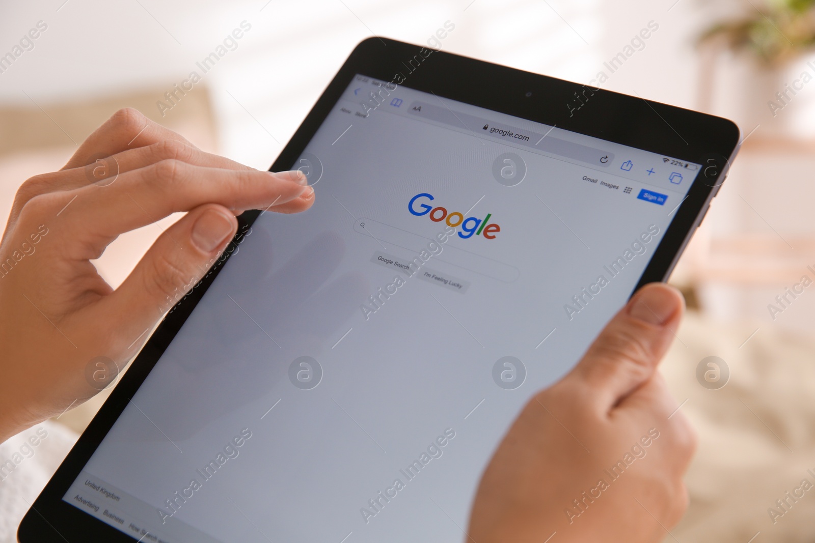 Photo of MYKOLAIV, UKRAINE - OCTOBER 31, 2020: Woman using Google search engine on tablet indoors, closeup