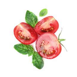 Fresh green basil leaves with cut tomato on white background, top view