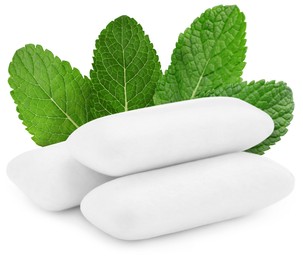 Image of Menthol chewing gum pillows and mint leaves on white background