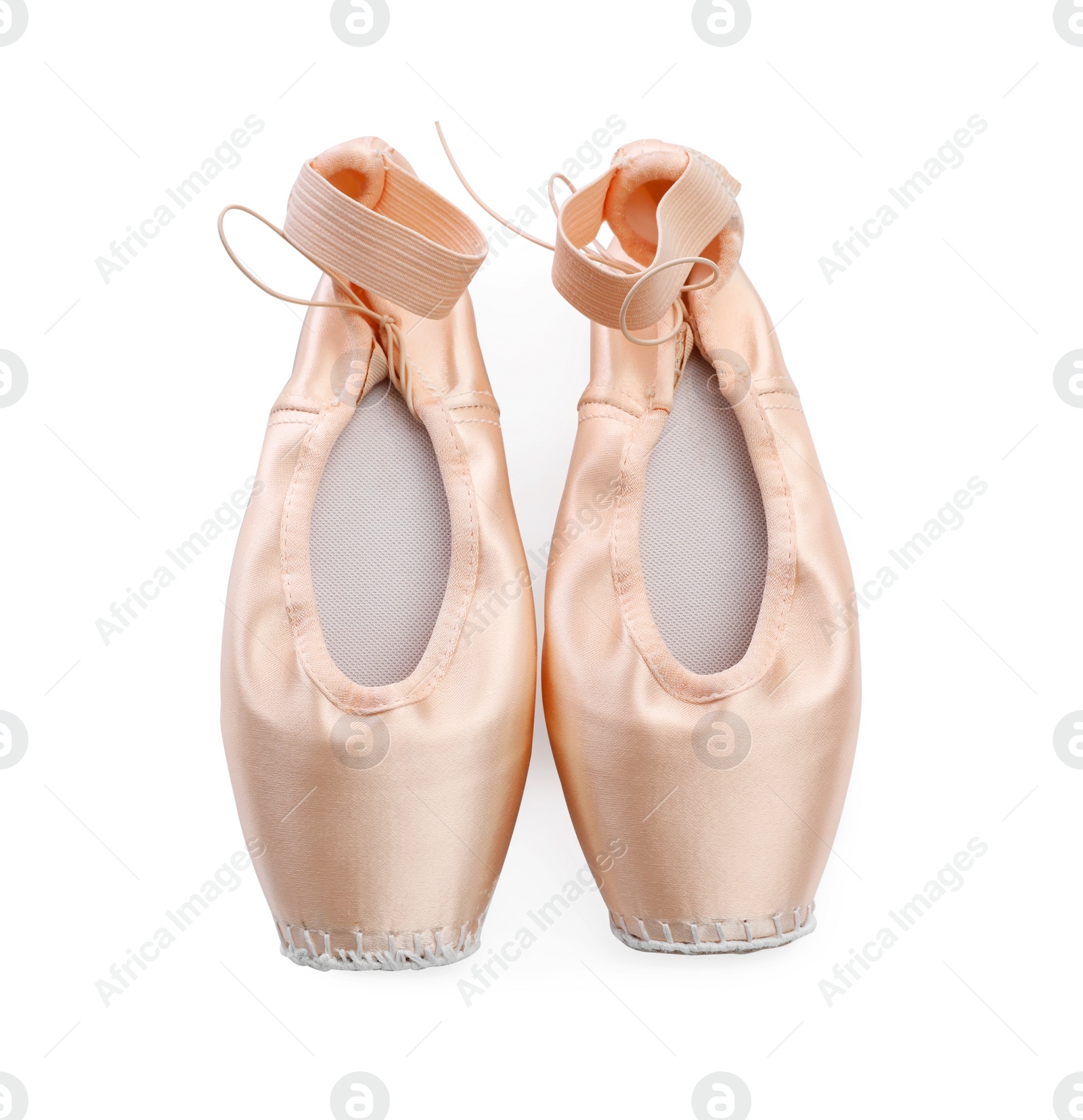 Photo of Beautiful beige ballet shoes isolated on white, top view