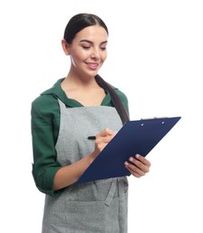 Photo of Young woman in grey apron with clipboard on white background