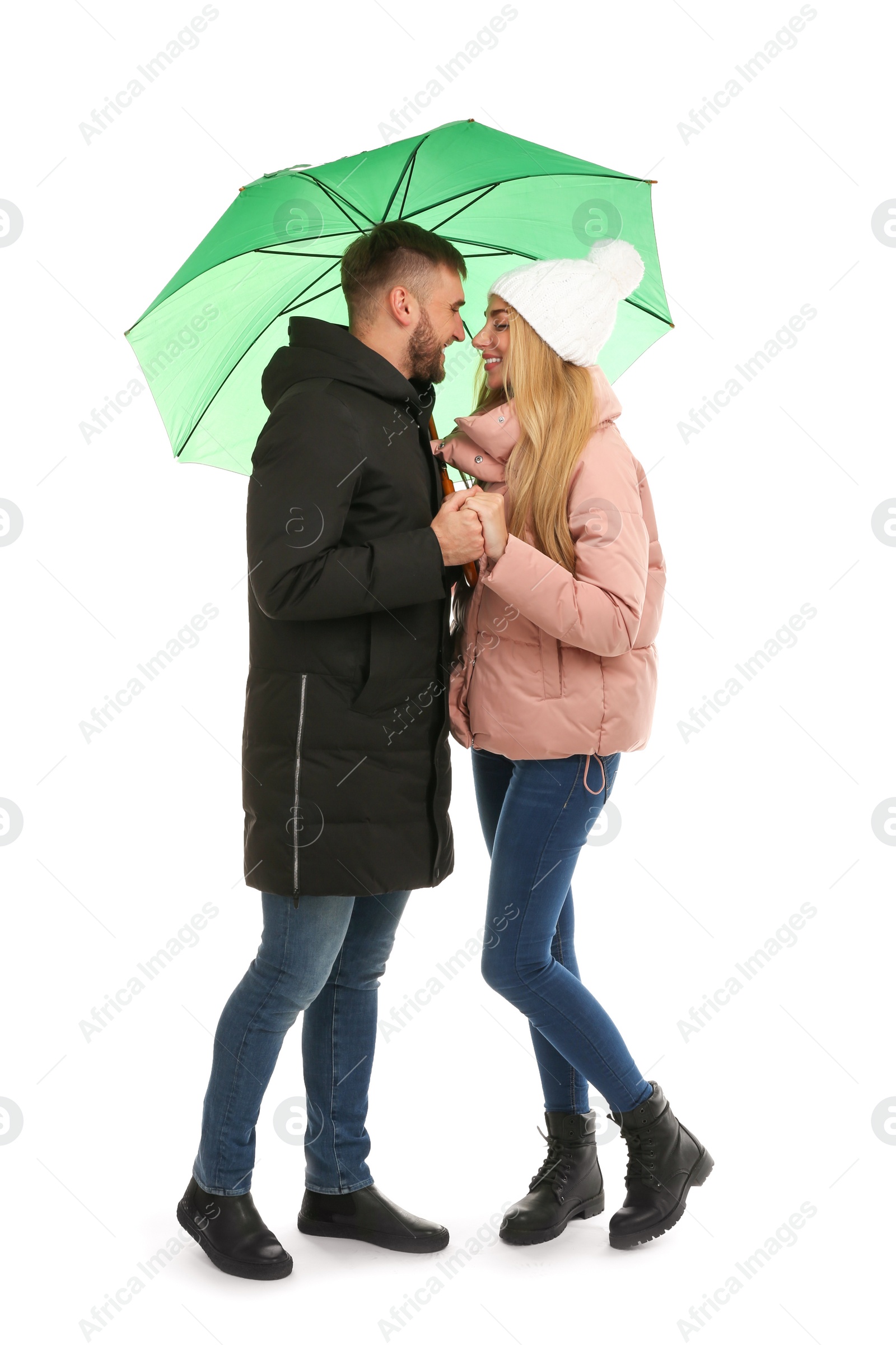 Photo of Full length portrait of beautiful couple with umbrella, isolated on white