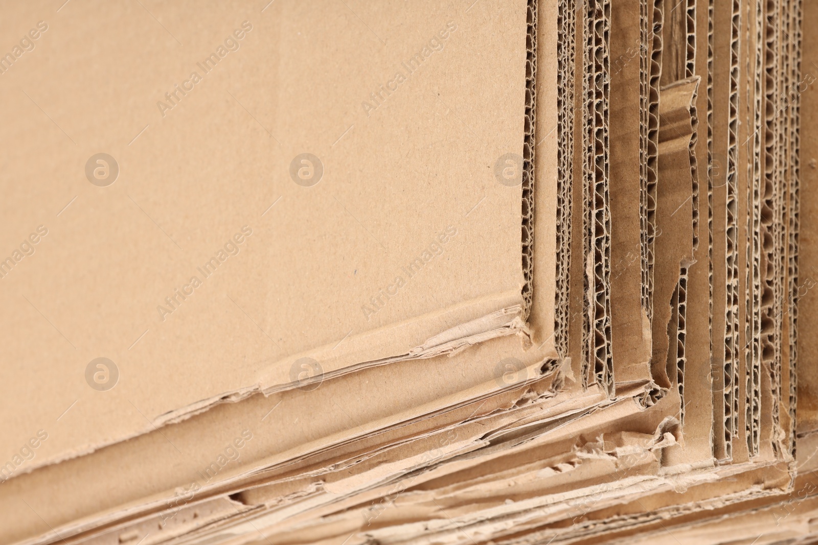 Photo of Sheets of brown corrugated cardboard as background, closeup