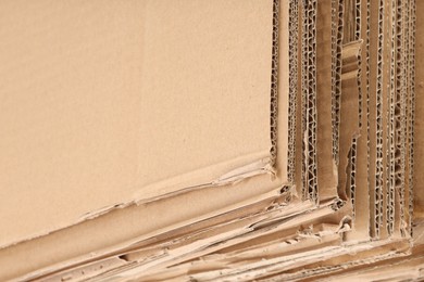 Photo of Sheets of brown corrugated cardboard as background, closeup