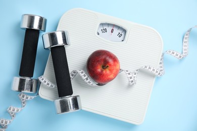 Photo of Flat lay composition with scales on light blue background