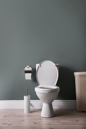 New ceramic toilet bowl in modern bathroom
