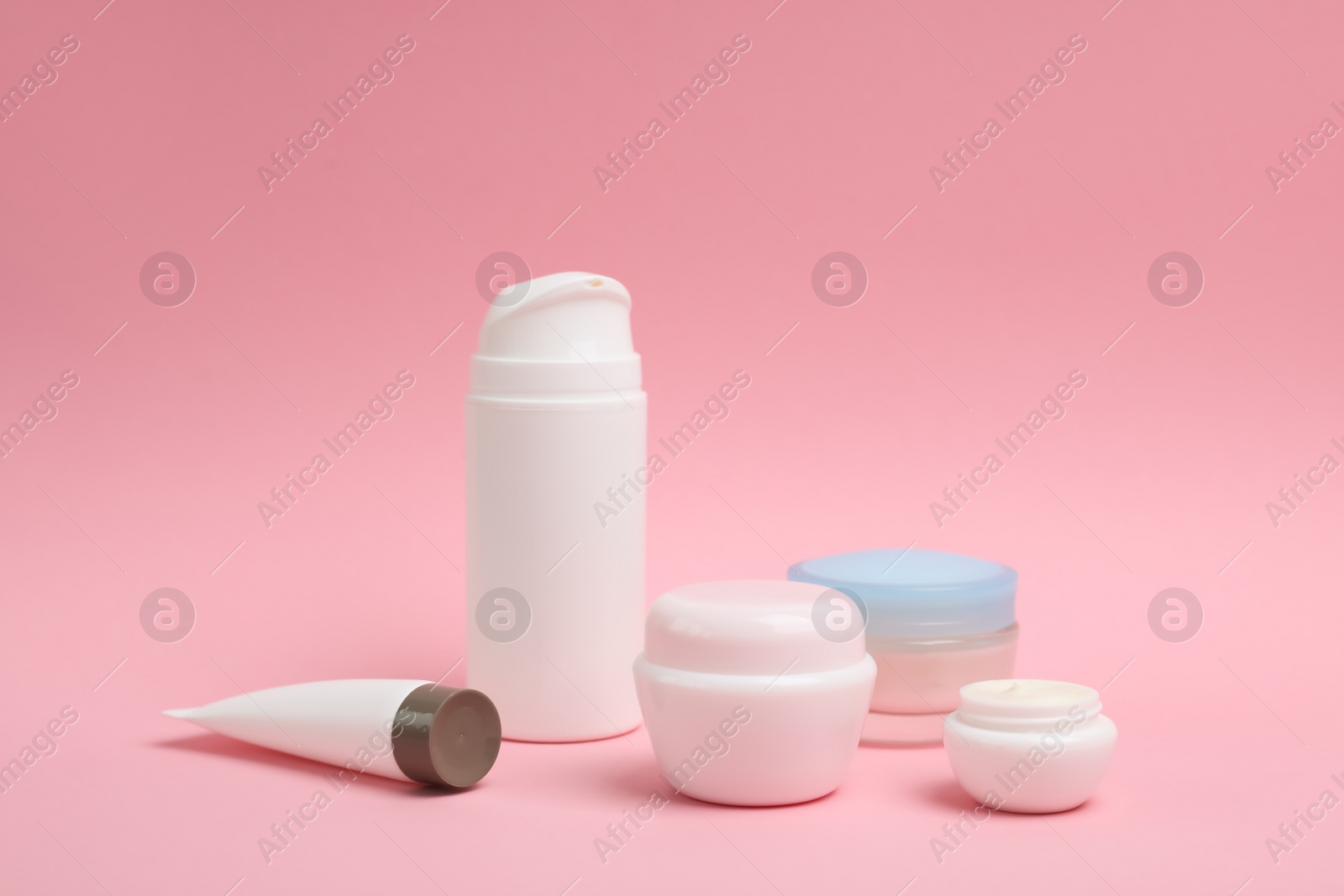 Photo of Cosmetic products on color background