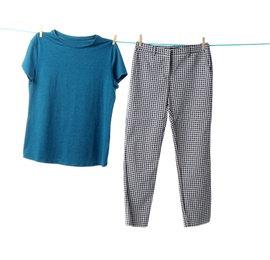 Clothes on laundry line against white background