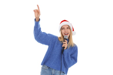 Photo of Happy woman in Santa Claus hat singing with microphone on white background. Christmas music