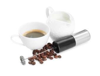 Mini mixer (milk frother), cup, coffee beans and pitcher isolated on white