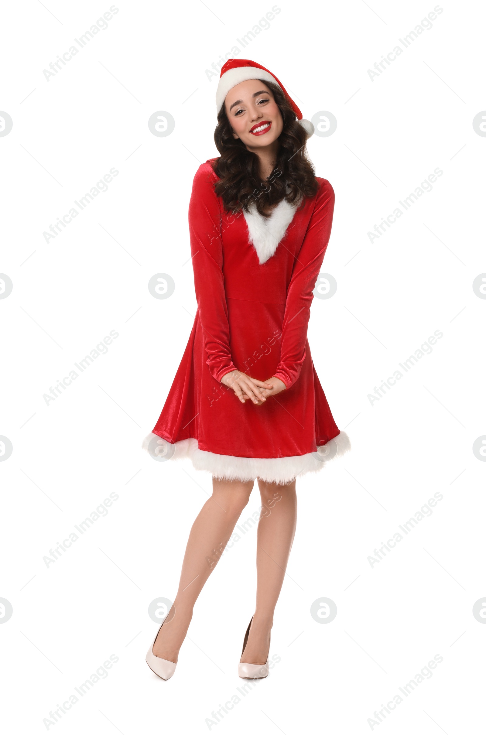 Photo of Beautiful young woman in Christmas red dress and Santa hat isolated on white