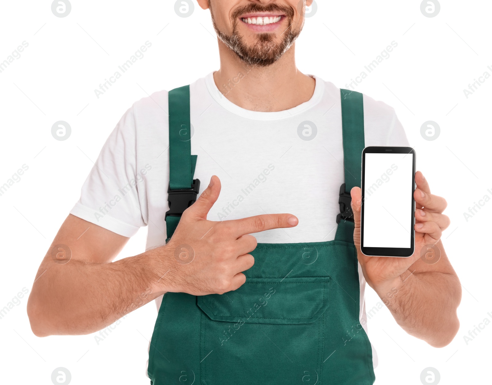 Photo of Professional repairman in uniform with phone on white background, closeup