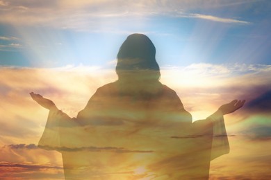 Image of Silhouette of Jesus Christ and cloudy sky, double exposure