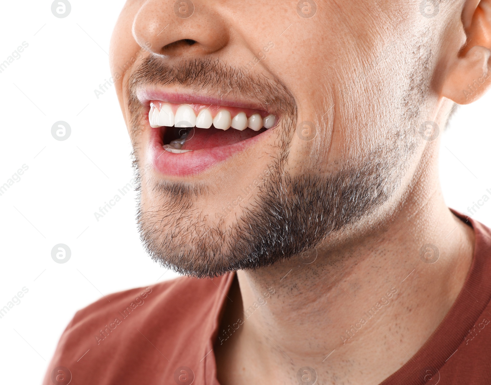 Photo of Smiling man with perfect teeth on white background, closeup