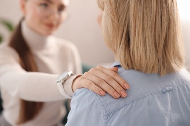 Psychotherapist working with patient in office, selective focus