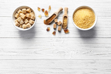 Composition with various kinds of sugar on wooden background