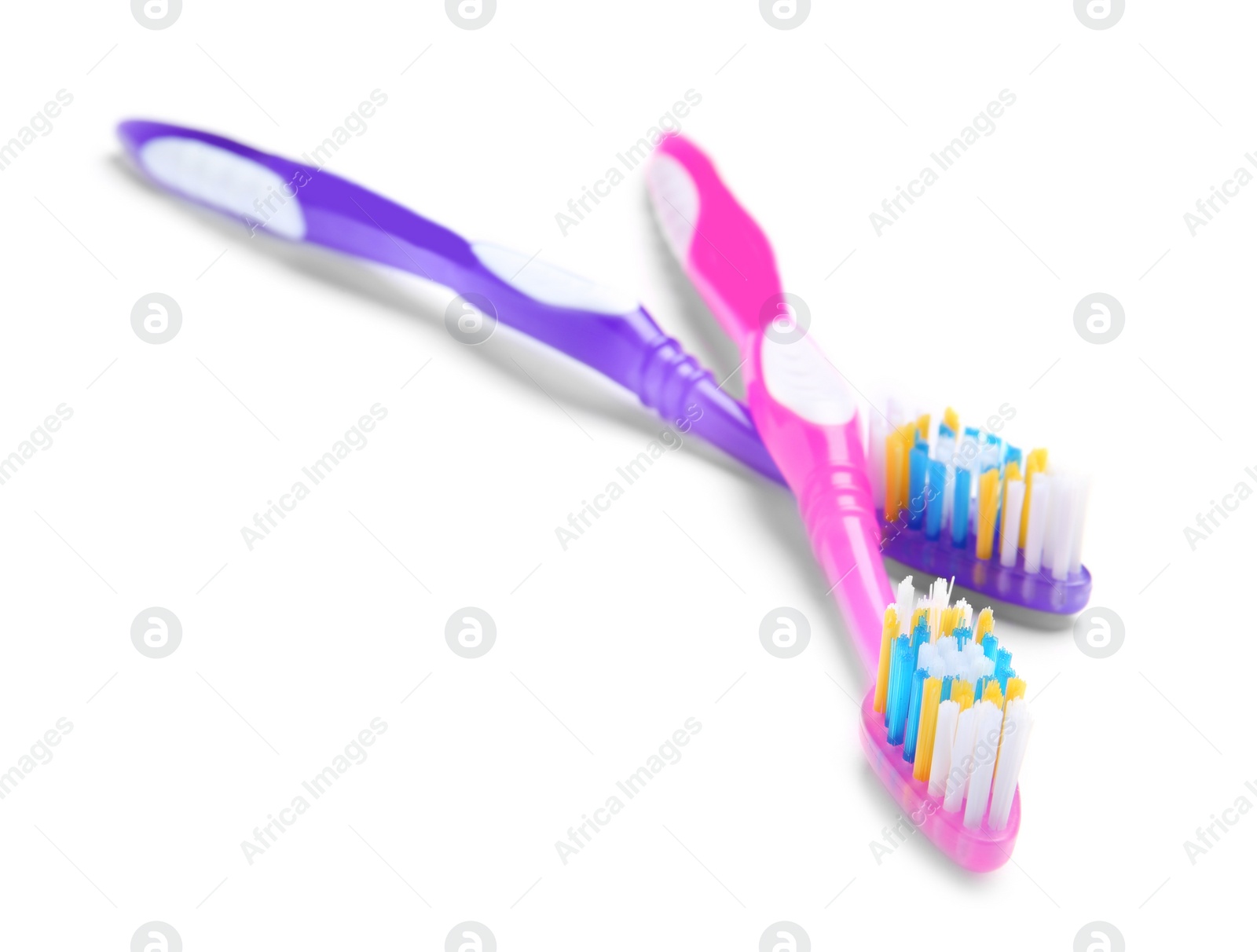 Photo of Color toothbrushes on white background. Dental care