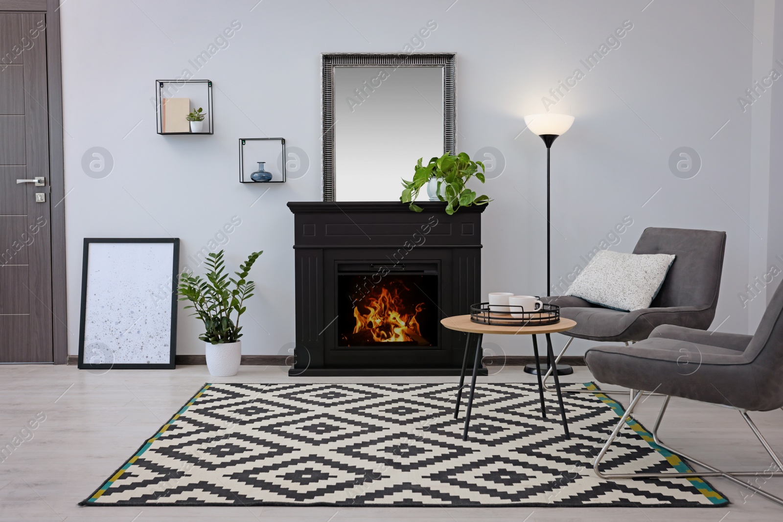 Photo of Stylish living room interior with decorative fireplace