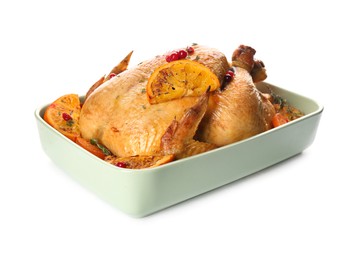 Photo of Roasted chicken with oranges isolated on white