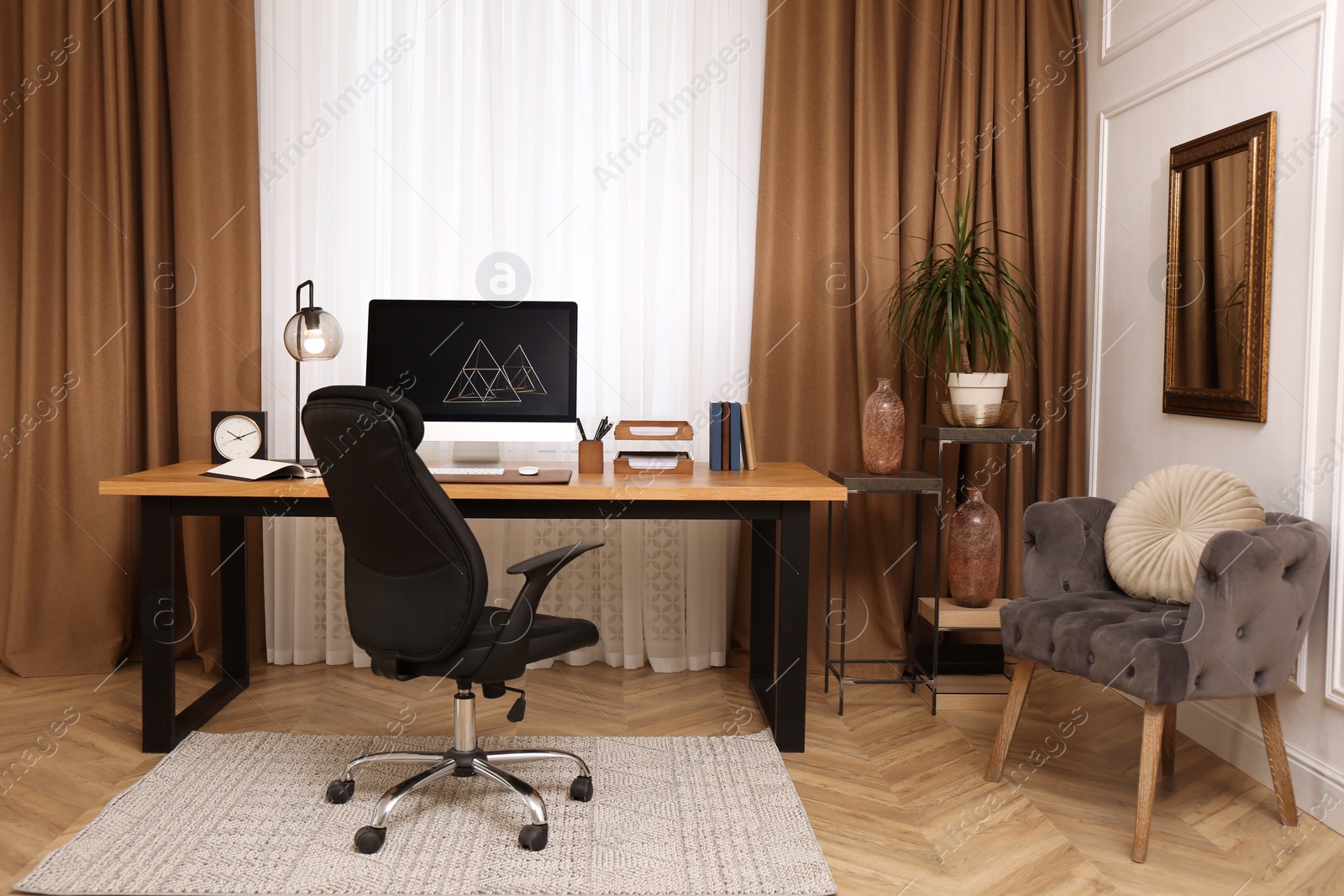 Photo of Stylish room interior with comfortable workplace near window